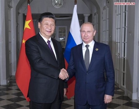 Xi, Putin Exchange Views on Glo